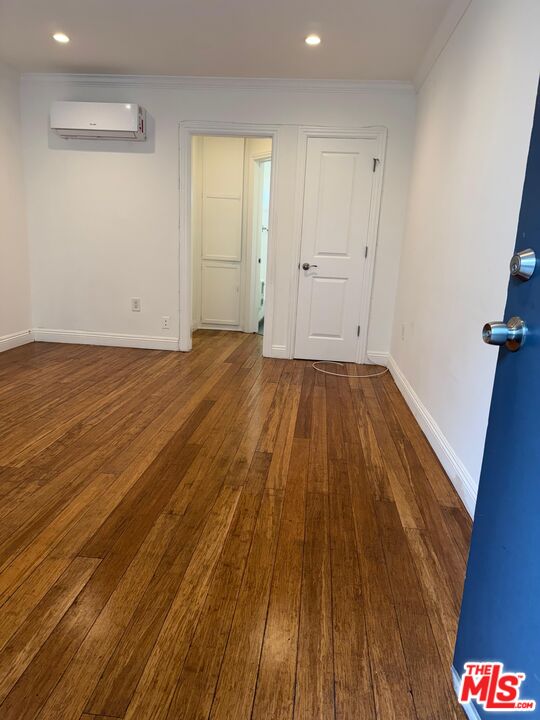 1625 South La Brea Avenue, Unit 4 Los Angeles, CA 90019 - Photo 2 of 7 a view of a room with wooden floor