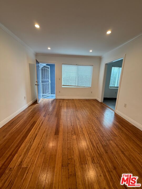 1625 South La Brea Avenue, Unit 4 Los Angeles, CA 90019 - Photo 3 of 7 a view of a room with wooden floor and window
