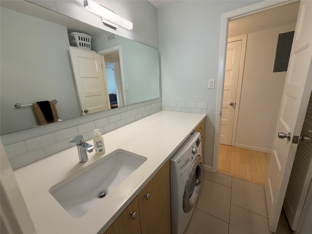 300 Crockett Street, Unit 201 Austin, TX 78704 - Photo 11 of 32 a bathroom with a sink and a mirror