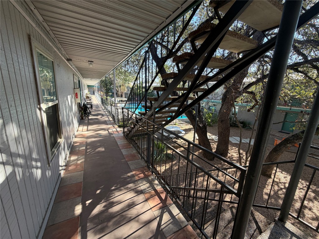 300 Crockett Street, Unit 201 Austin, TX 78704 - Photo 23 of 32 a view of a patio with table and chairs and potted plants