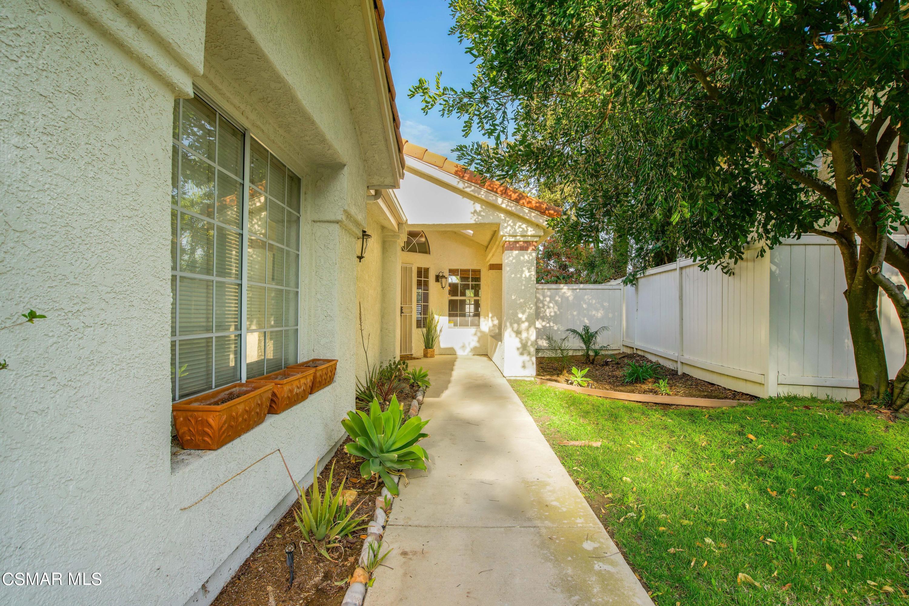 486 Fresh Meadows Road Simi Valley, CA 93065 - Photo 2 of 30 a front view of a house with a yard