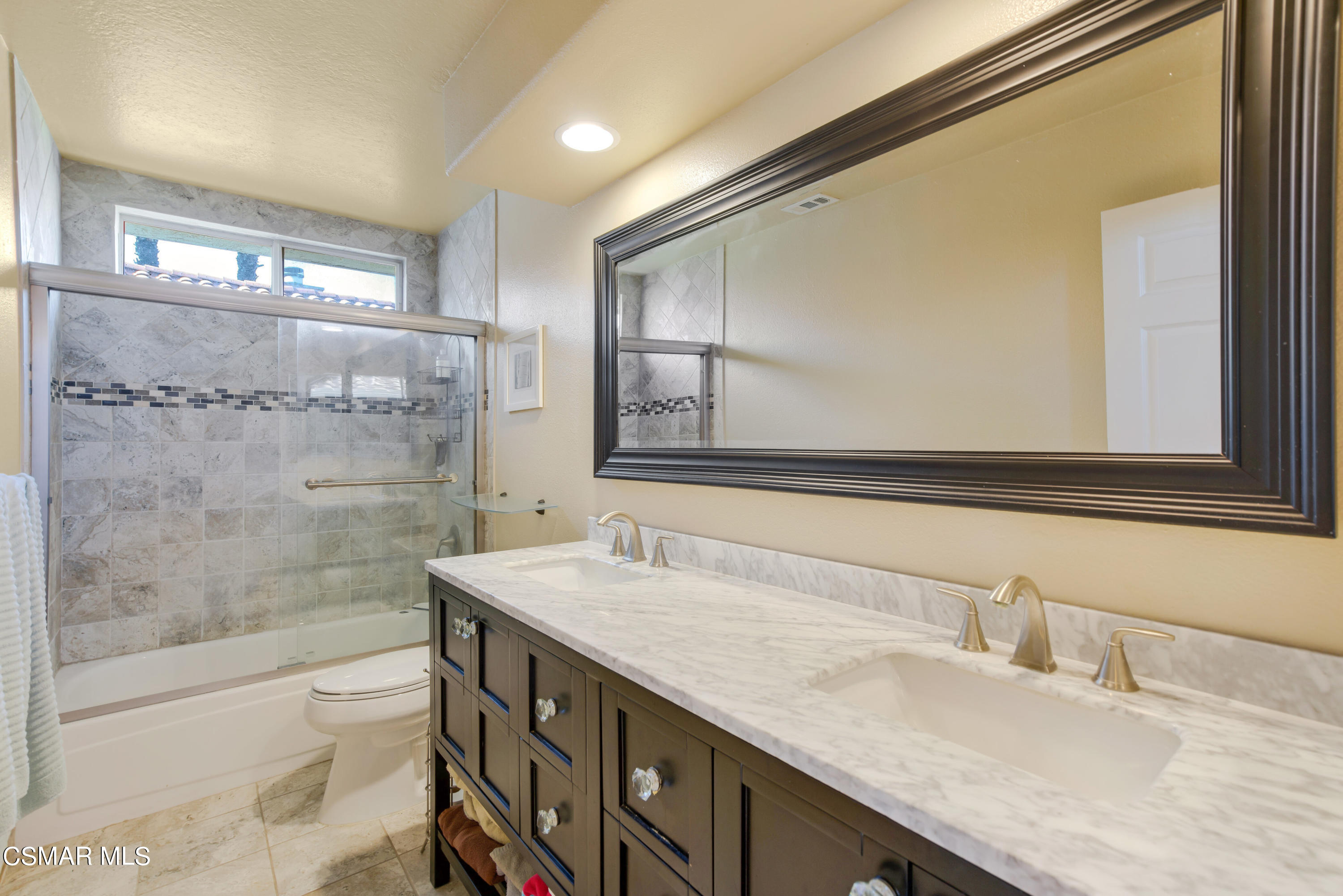 486 Fresh Meadows Road Simi Valley, CA 93065 - Photo 22 of 30 a bathroom with a granite countertop sink mirror and double