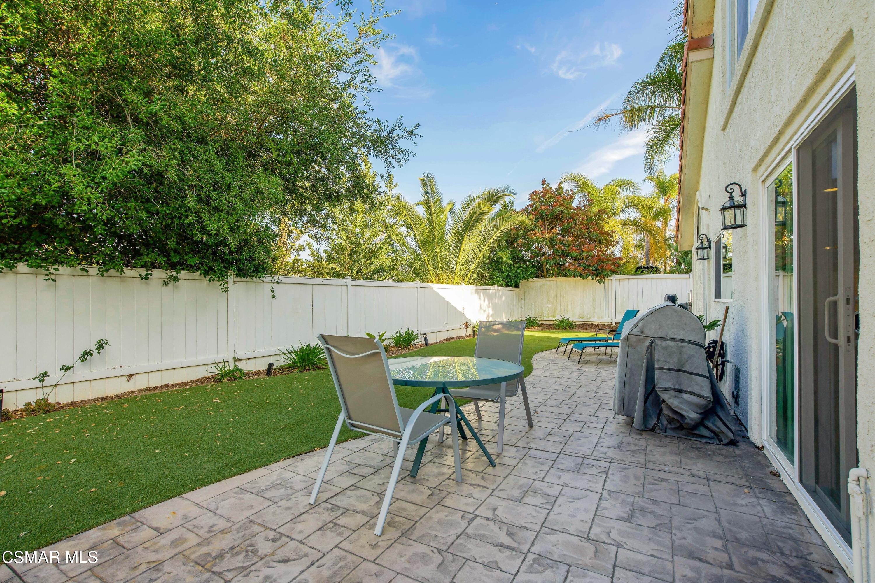 486 Fresh Meadows Road Simi Valley, CA 93065 - Photo 27 of 30 a view of outdoor dining space with a table and chairs