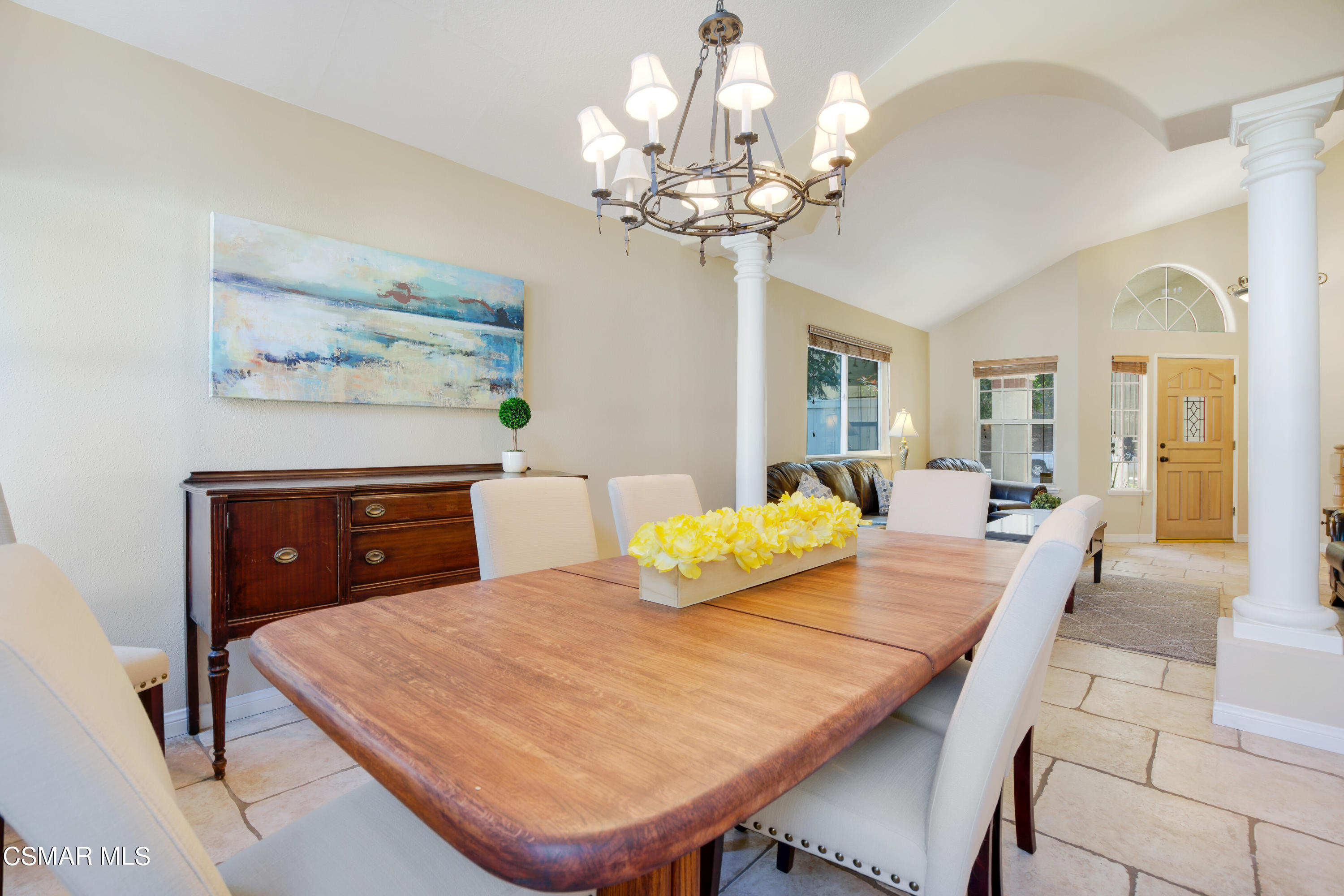 486 Fresh Meadows Road Simi Valley, CA 93065 - Photo 6 of 30 a living room with dining table and a chandelier