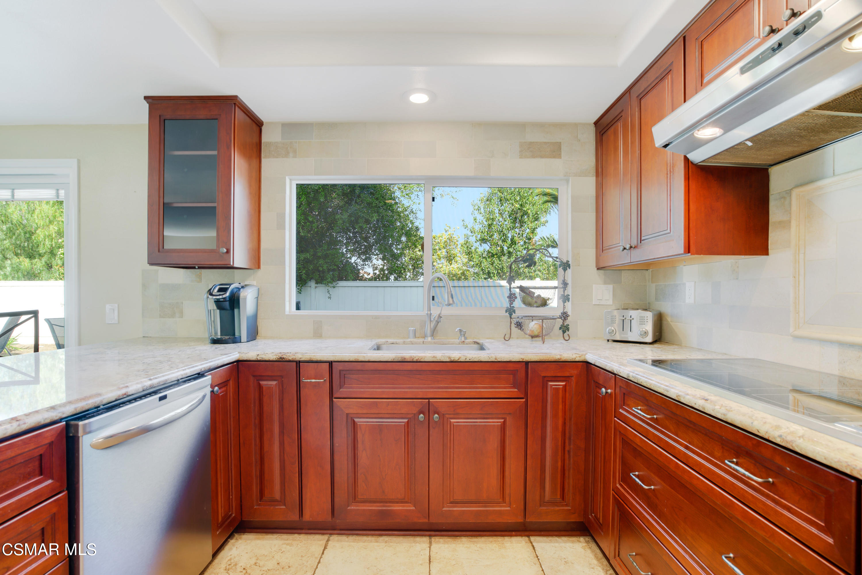 486 Fresh Meadows Road Simi Valley, CA 93065 - Photo 9 of 30 a kitchen with stainless steel appliances granite countertop a sink and cabinets