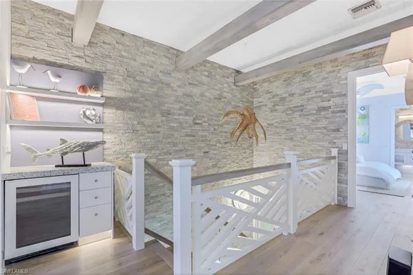 a spacious bathroom with a granite countertop sink a toilet and a mirror