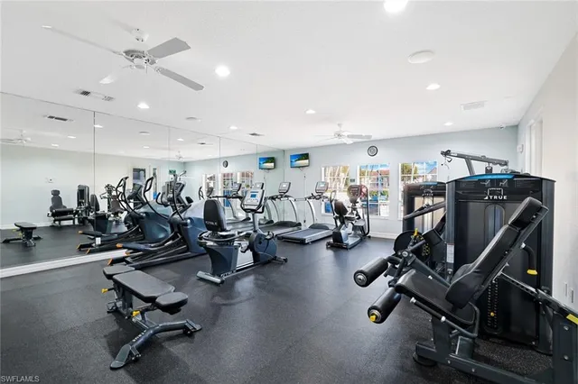 a view of swimming pool with lounge chair and dinning tables