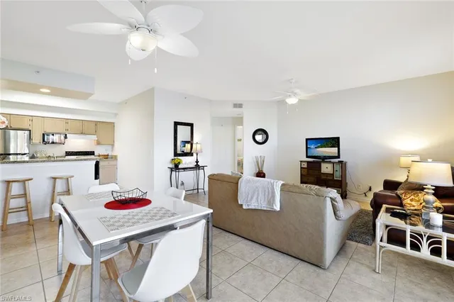 a kitchen with a granite countertop refrigerator and a sink