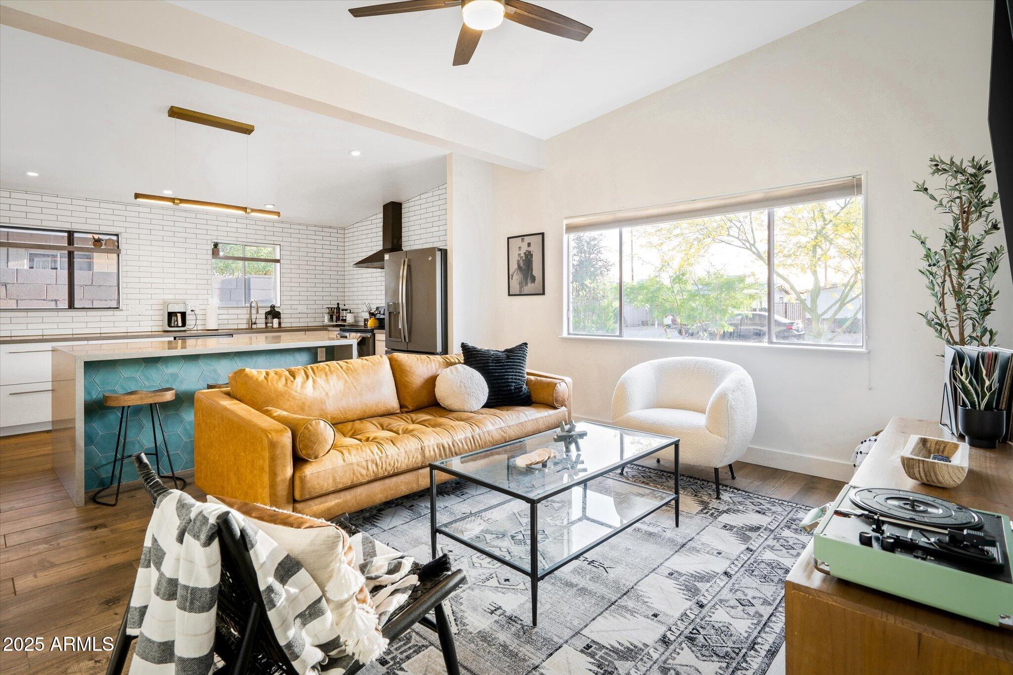 2307 North 51st Place Phoenix, AZ 85008 - Photo 1 of 41 a living room with furniture and a fireplace
