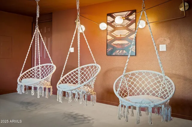 a view of a chairs and table in a patio