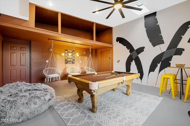 a bedroom with a bed and flat screen tv