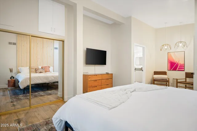 a room with furniture and flat screen tv