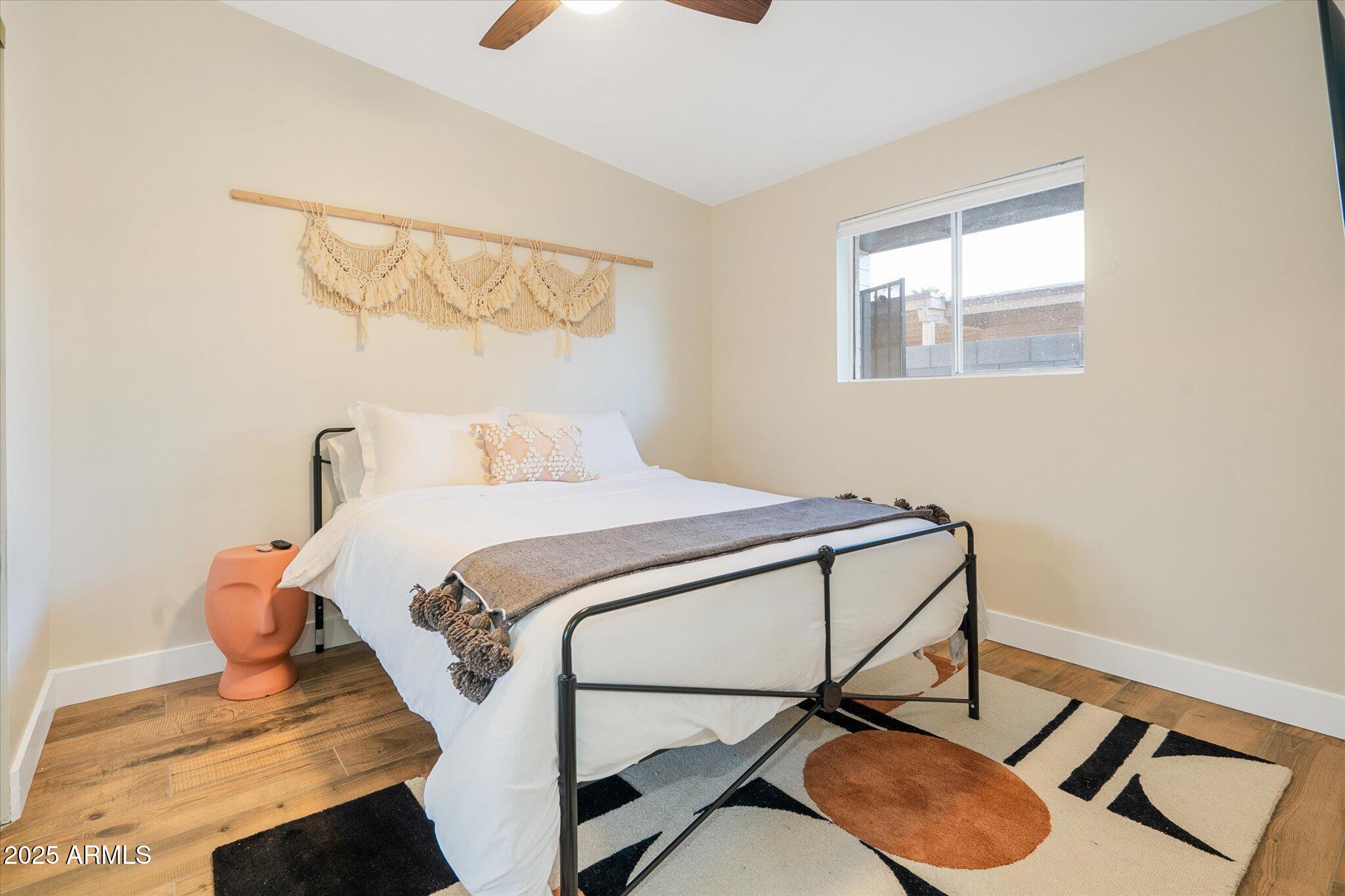 2307 North 51st Place Phoenix, AZ 85008 - Photo 20 of 41 a bedroom with a bed and a window