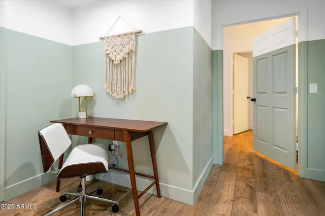 a bedroom with a bed and a lamp