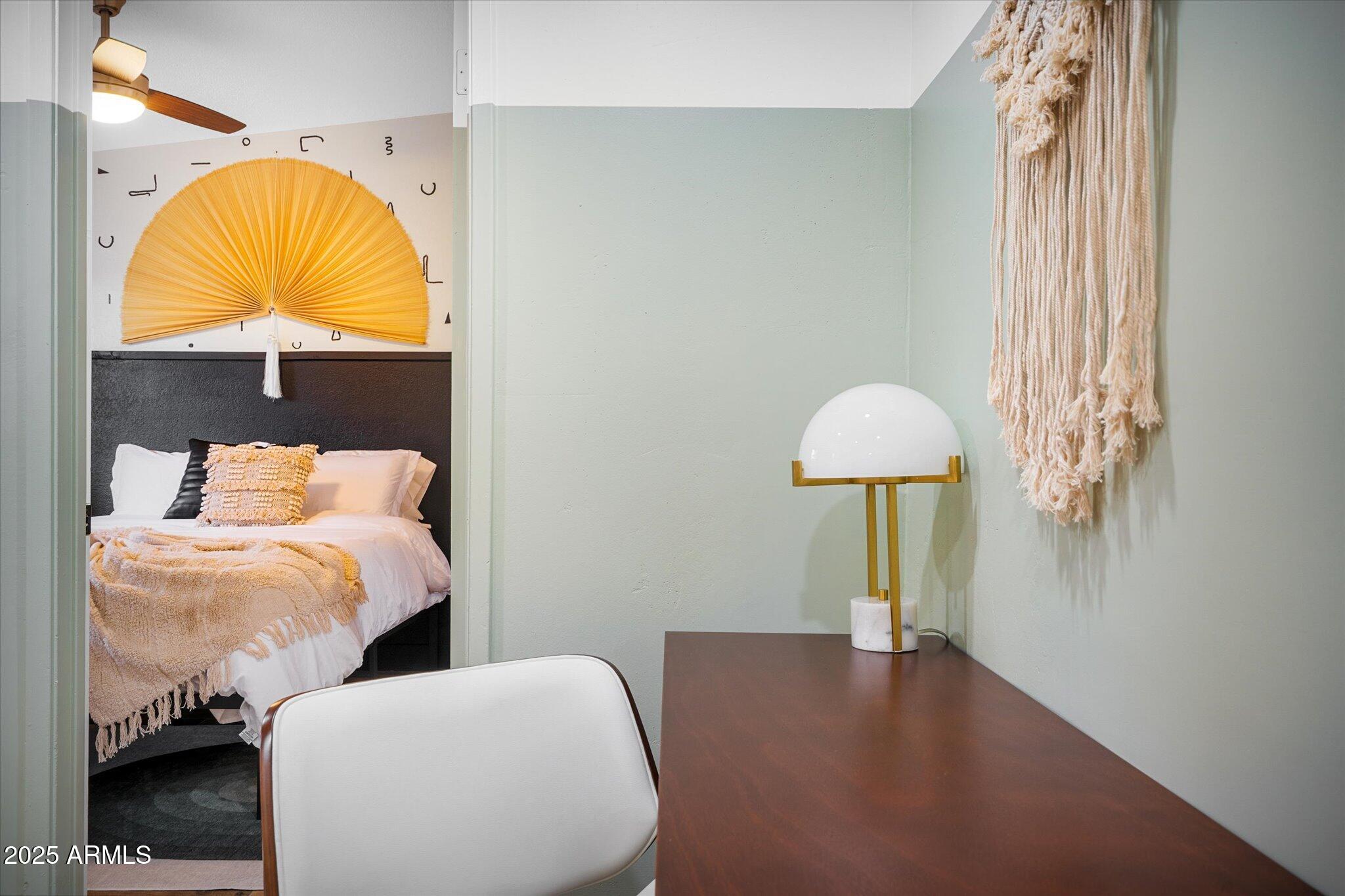 2307 North 51st Place Phoenix, AZ 85008 - Photo 23 of 41 a bedroom with a bed and a lamp