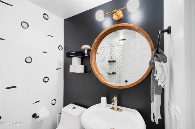 a bedroom with a bed and flat screen tv