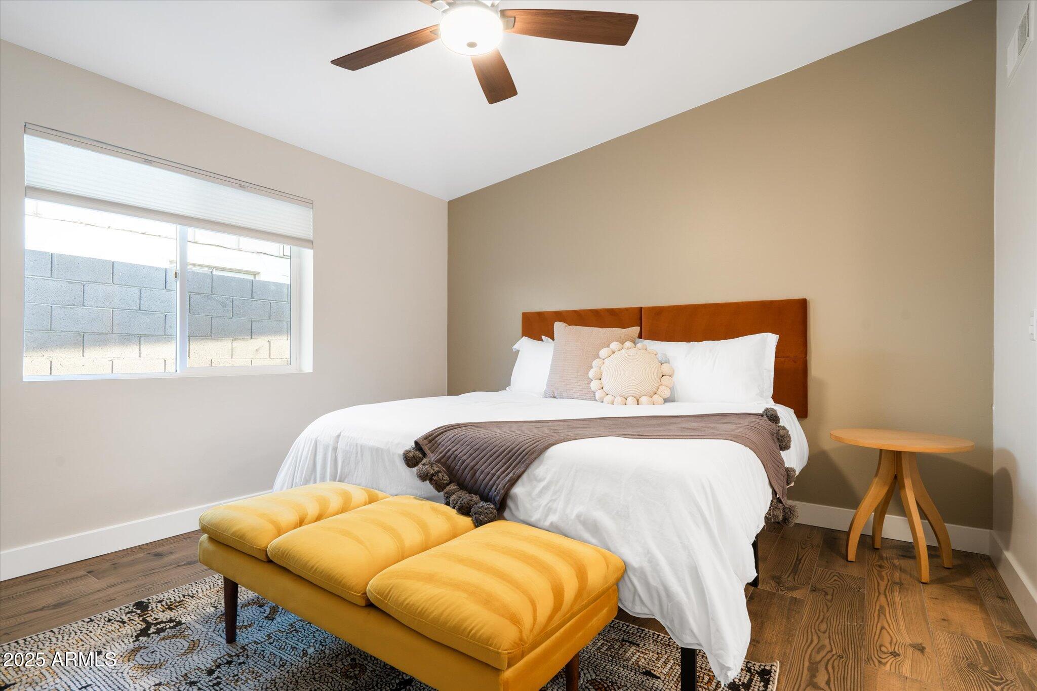 2307 North 51st Place Phoenix, AZ 85008 - Photo 31 of 41 a bedroom with two beds and wooden floor