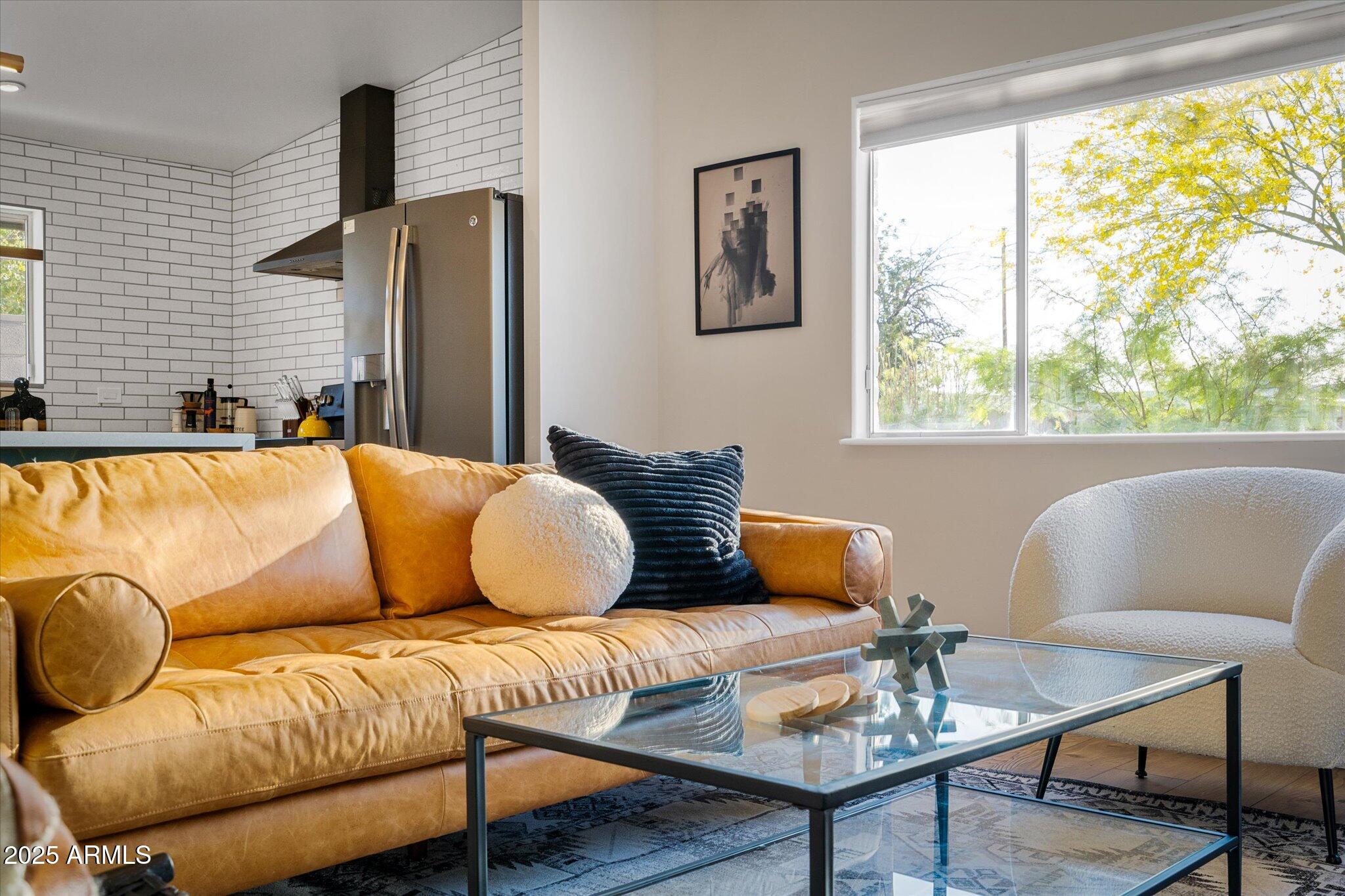 2307 North 51st Place Phoenix, AZ 85008 - Photo 4 of 41 a living room with furniture and a large window
