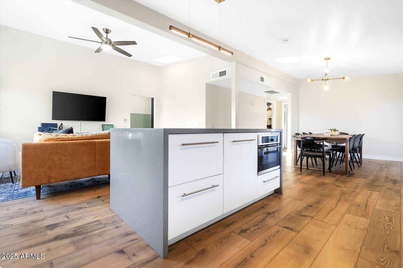 2307 North 51st Place Phoenix, AZ 85008 - Photo 41 of 41 a living room with furniture and a flat screen tv