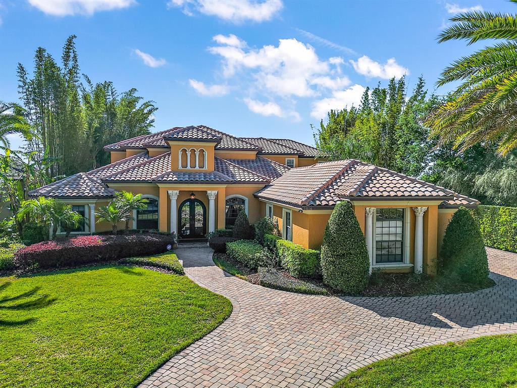 Welcome home to this exquisite Mediterranean lakefront estate with pool, and private boat dock.
