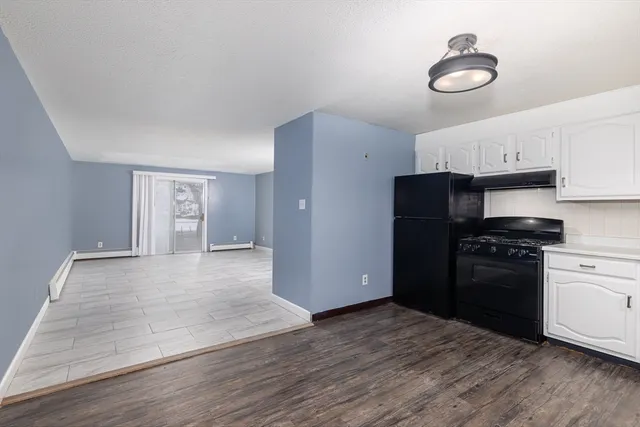 a kitchen with a refrigerator and a stove