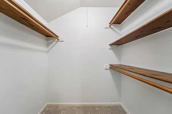a view of room with a ceiling fan and window
