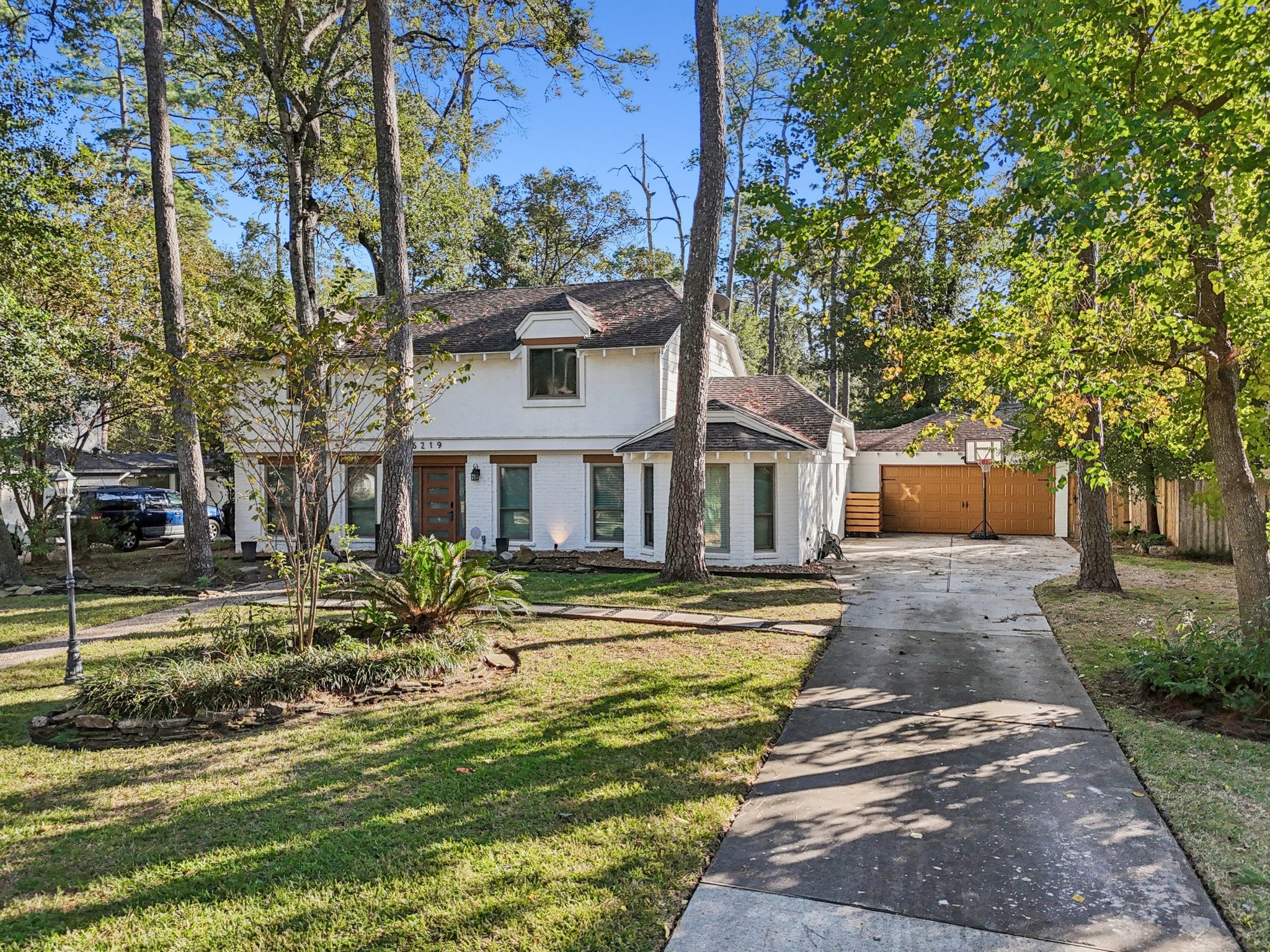 6219 Elmgrove Road Spring, TX 77389 - Photo 48 of 49 a front view of a house with a yard table and chairs