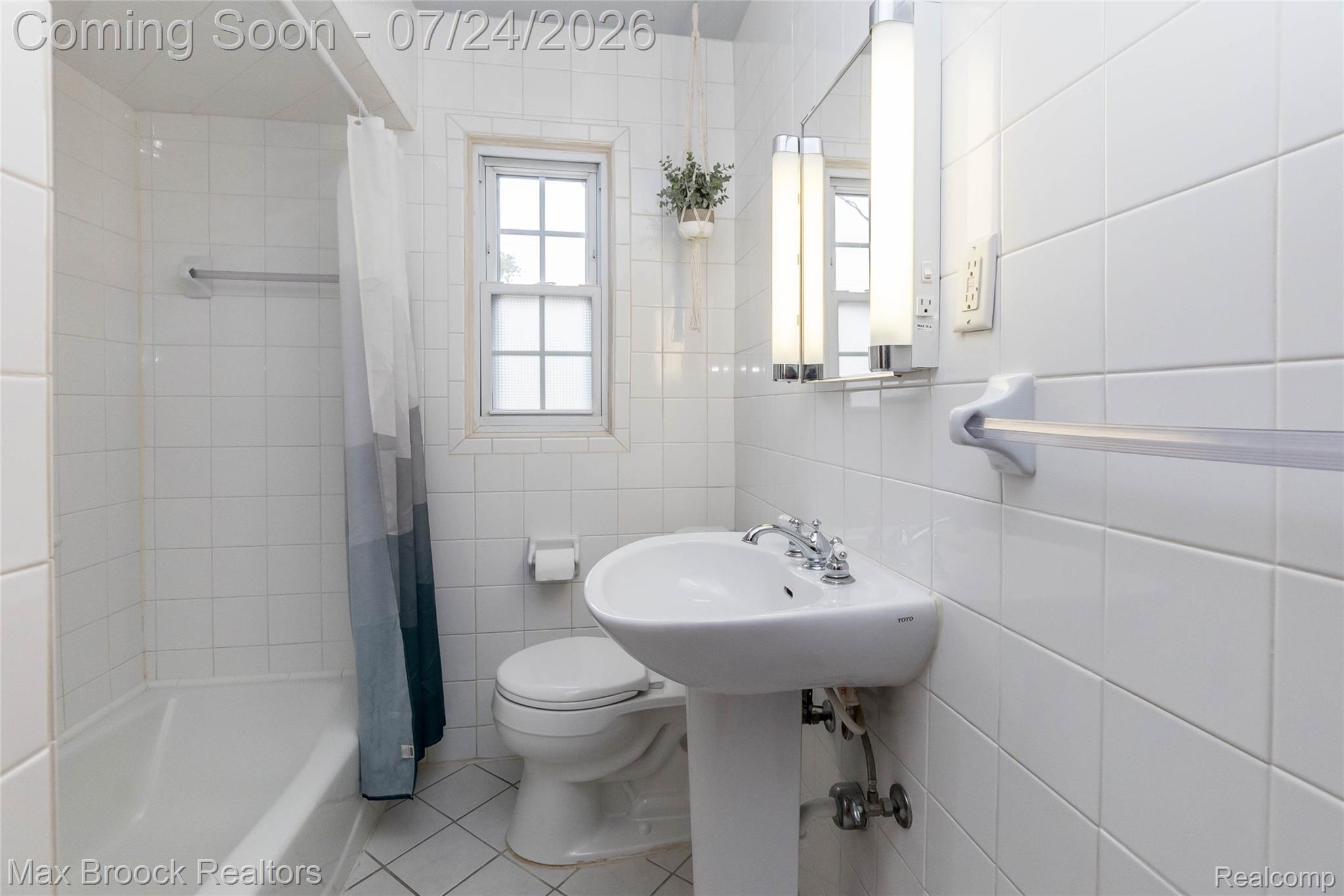 1090 Cambridge Road Berkley, MI 48072 - Photo 15 of 43 Bathroom featuring a pedestal sink with chrome fixtures, a mirrored vanity with integrated lighting, and a window with frosted panes