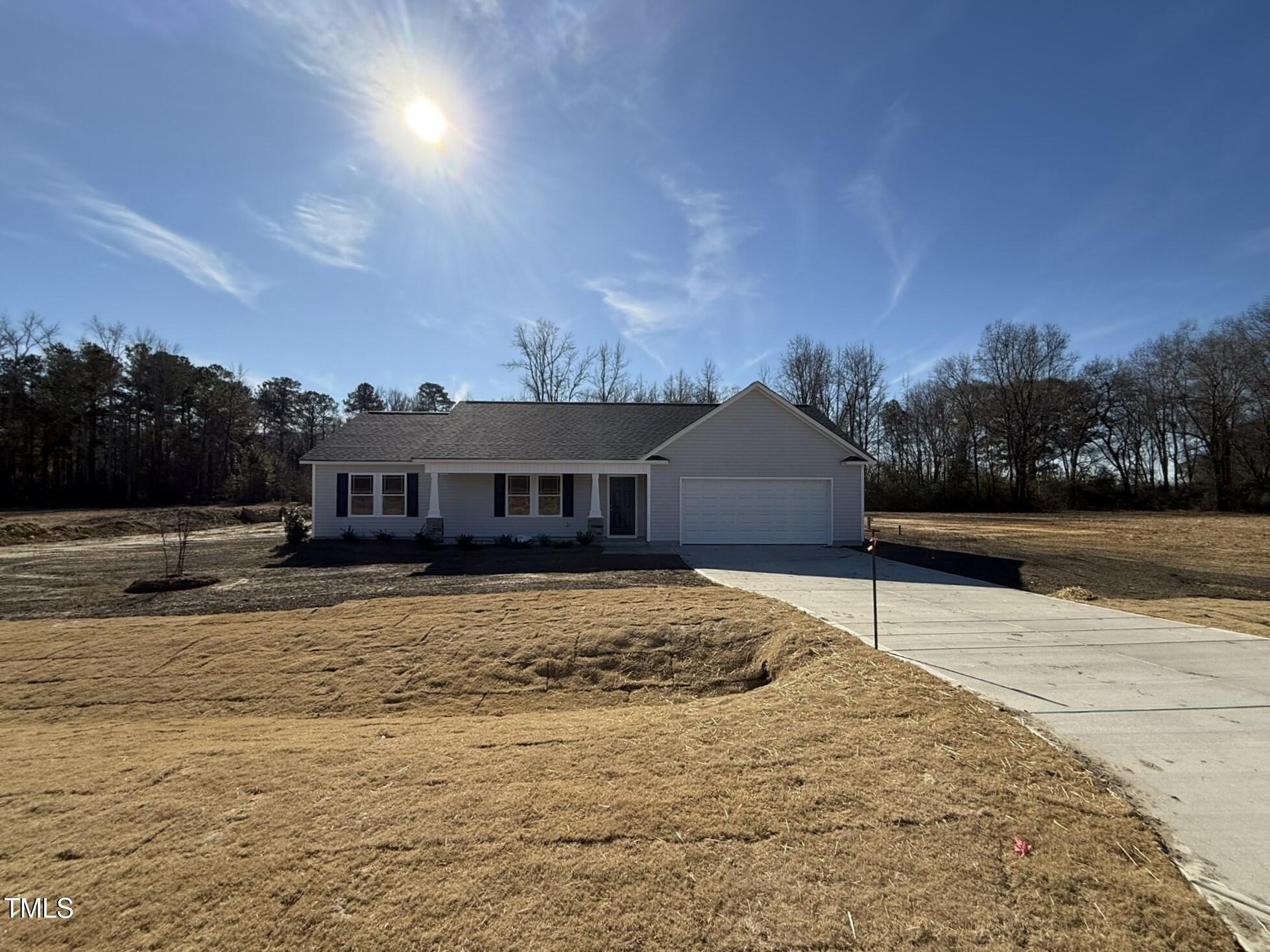 73 Phil Jack Road Dunn, NC 28334 - Photo 1 of 17 a house with yard in front of it