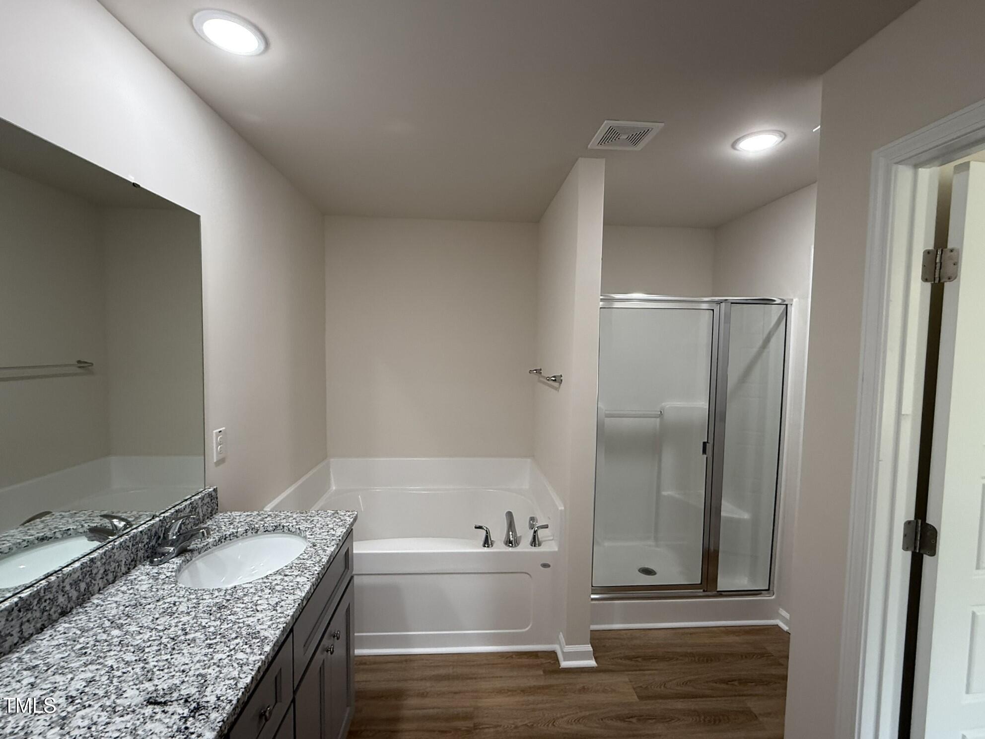 73 Phil Jack Road Dunn, NC 28334 - Photo 11 of 17 a bathroom with a granite countertop tub sink and mirror