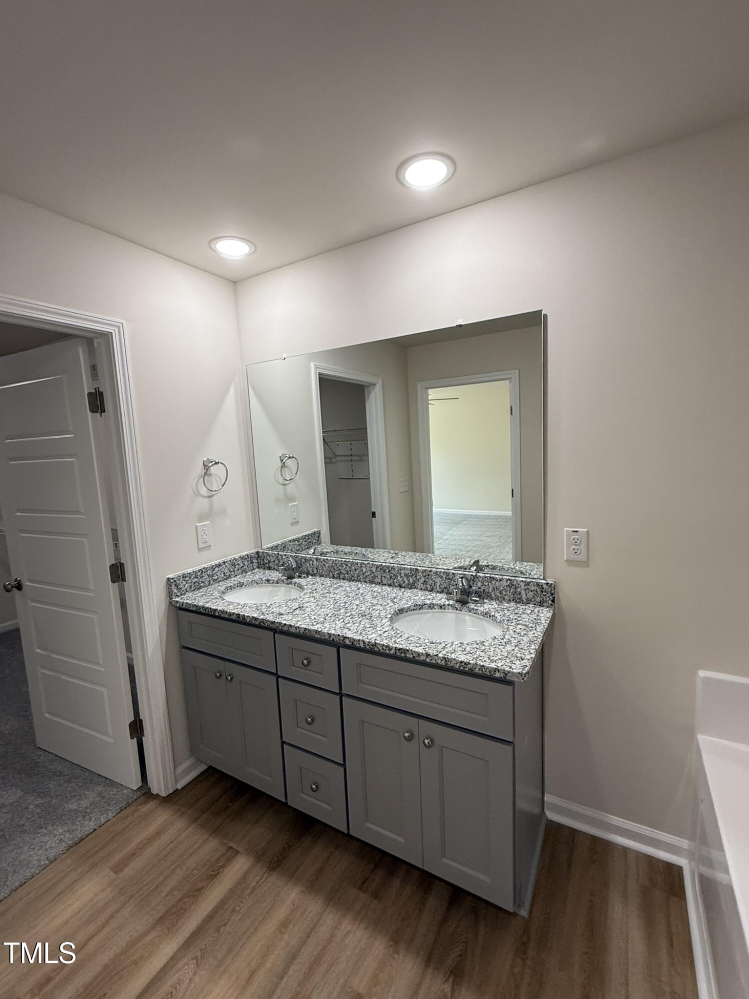 73 Phil Jack Road Dunn, NC 28334 - Photo 12 of 17 a bathroom with a granite countertop sink and a mirror