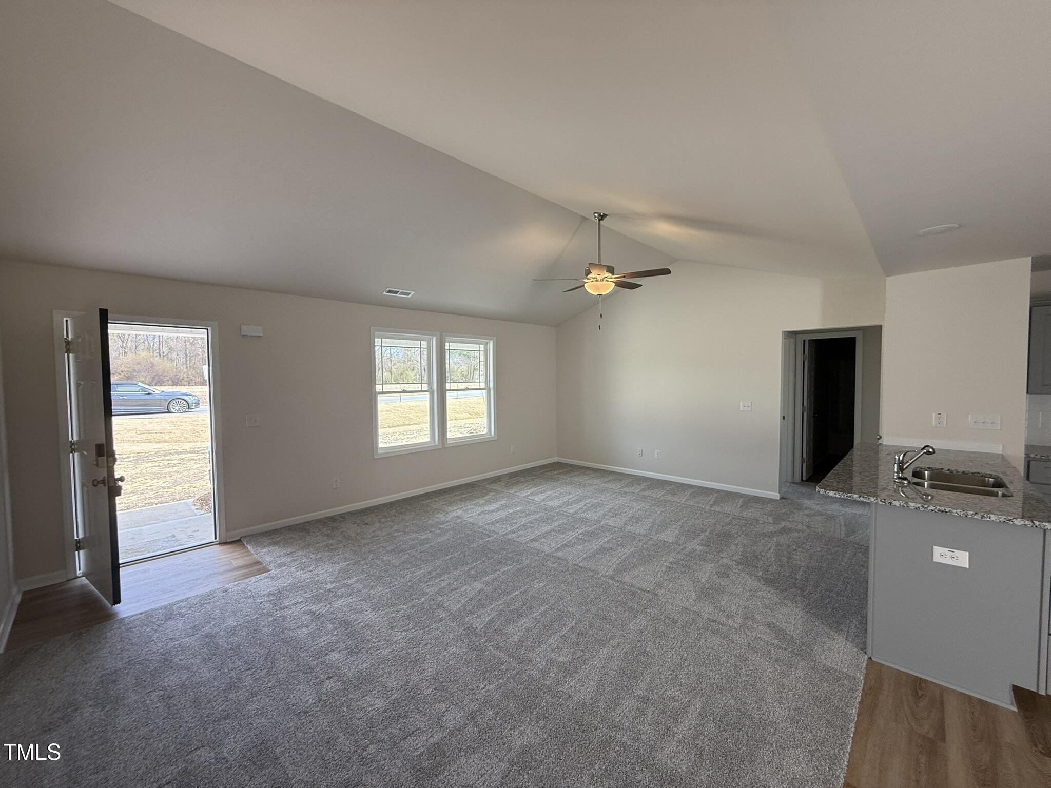 73 Phil Jack Road Dunn, NC 28334 - Photo 3 of 17 an empty room with windows