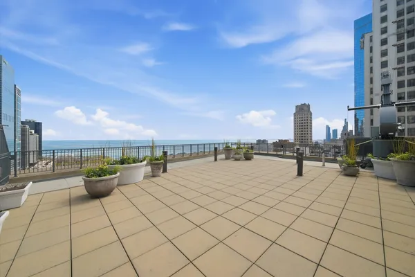 a view of roof deck with seating space