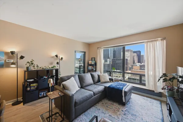 a living room with furniture and a large window