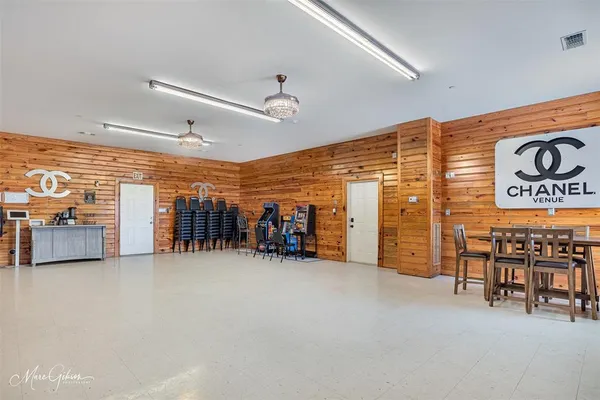 a view of a livingroom with furniture and a garage