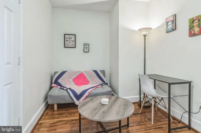 a bathroom with a sink toilet and a mirror