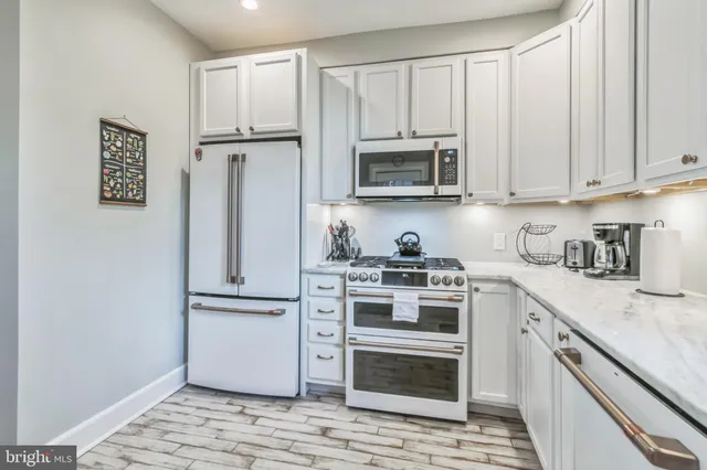 a bedroom with a bed and a table