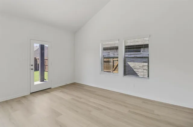 an empty room with windows