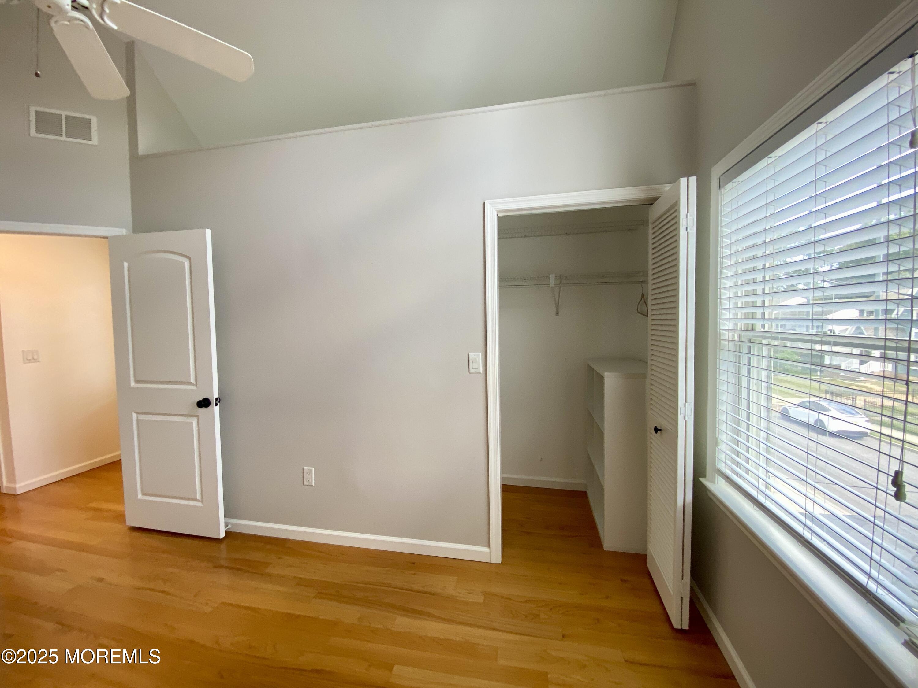 32 1st Street Rumson, NJ 07760 - Photo 14 of 25 an empty room with wooden floor and windows