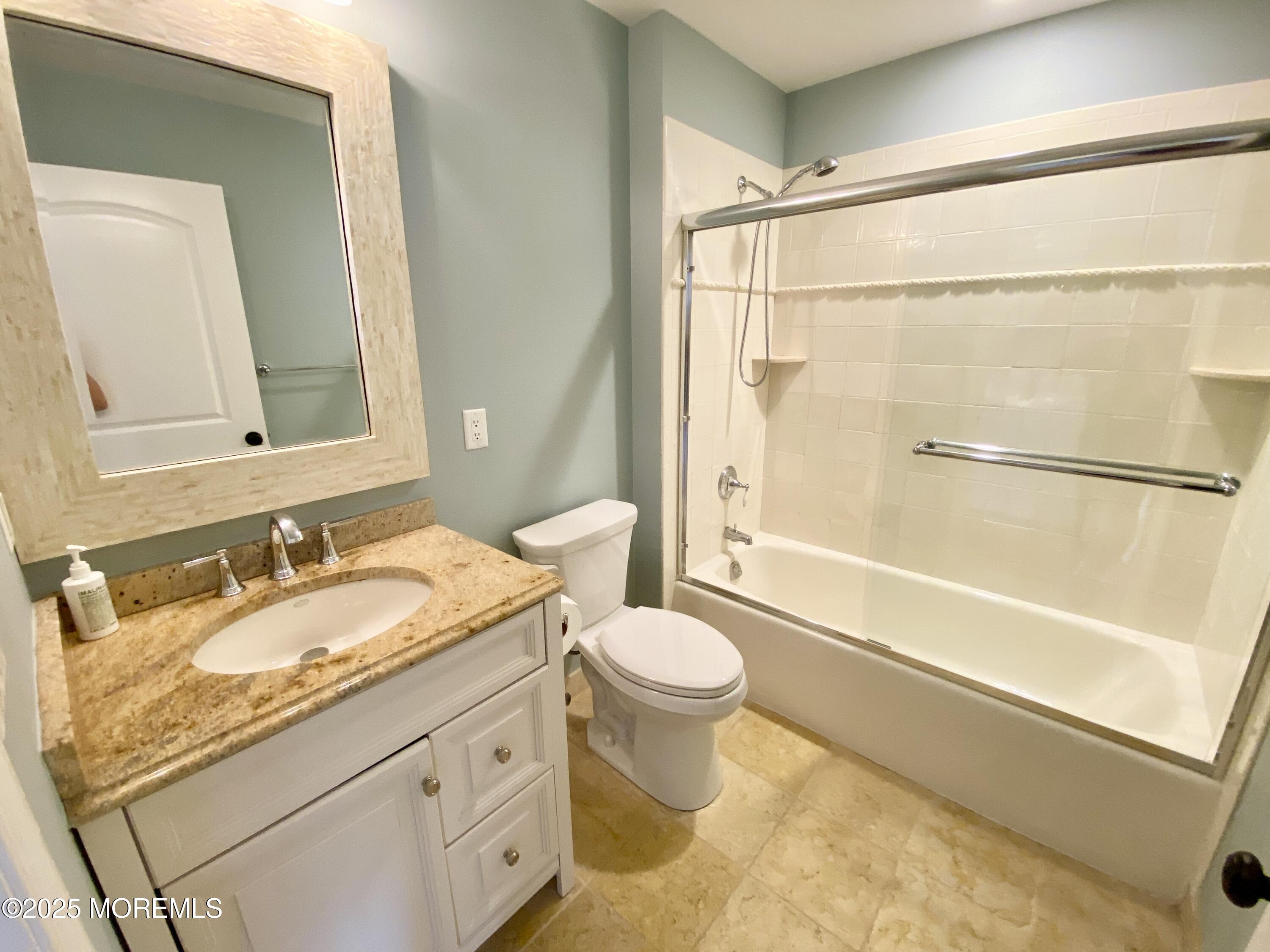 32 1st Street Rumson, NJ 07760 - Photo 18 of 25 a bathroom with a granite countertop sink toilet and shower