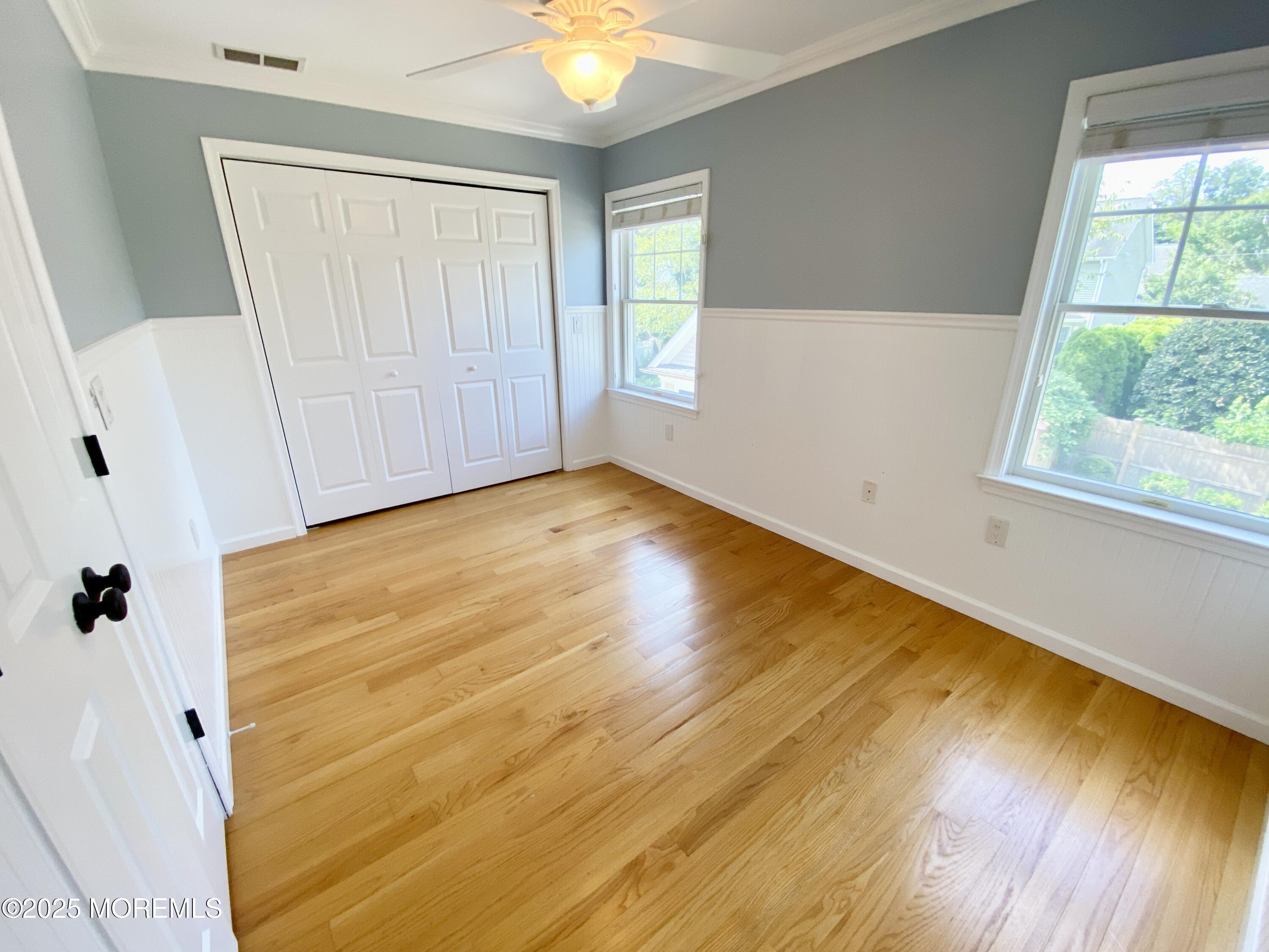 32 1st Street Rumson, NJ 07760 - Photo 20 of 25 a view of an empty room with wooden floor and a window