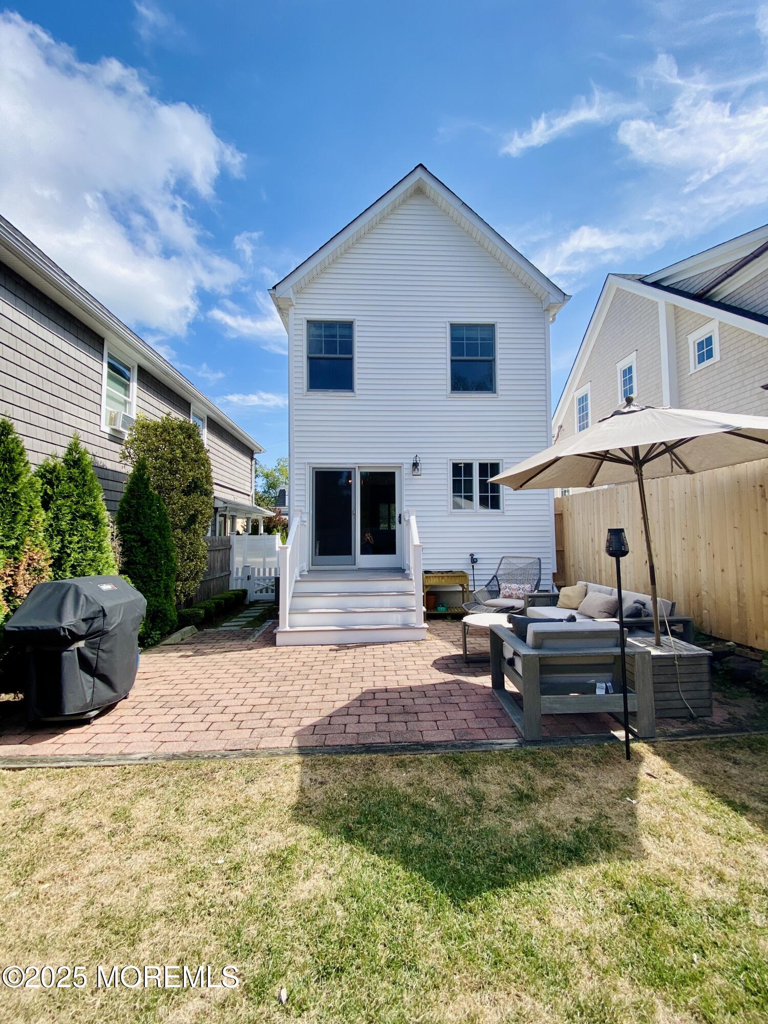 32 1st Street Rumson, NJ 07760 - Photo 22 of 25 a front view of a house with entertaining space