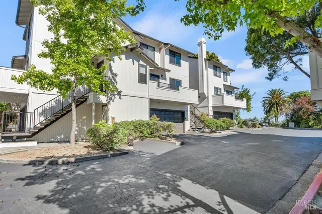 a front view of a house with a yard and a garage