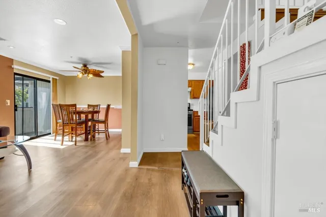 a dining room with furniture and wooden floor