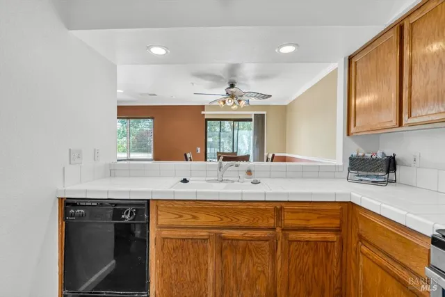 a kitchen with a sink and a window