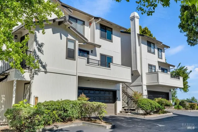 a front view of a house with garage