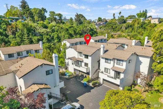aerial view of a house with a yard