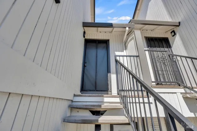 a view of entryway with wooden floor