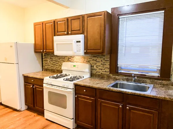 a kitchen that has a sink and a stove