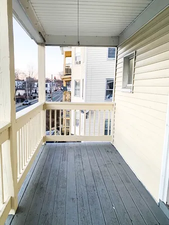a view of a deck with wooden floor and roof